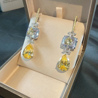 Sunveil Earrings in sterling silver with yellow lab sapphires, offering a delicate shimmer of sunlight-inspired elegance.