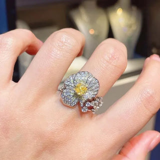 The Daffodils Ring in sterling silver with a radiant lab sapphire, floral-inspired cocktail ring for women in sculptural spring design

