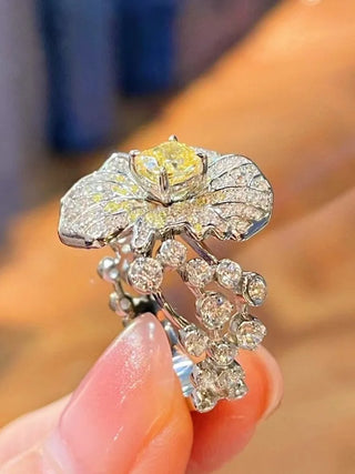 The Daffodils Ring in sterling silver with a radiant lab sapphire, floral-inspired cocktail ring for women in sculptural spring design

