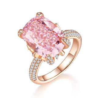 The Garden of Aurora Ring featuring an 8-carat pink lab-created sapphire in a rose gold setting, surrounded by sparkling lab sapphires. A symbol of love and new beginnings.


