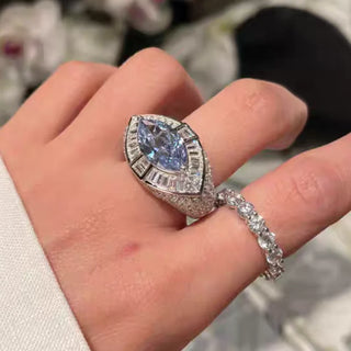 Pharaoh’s Eye Ring by Azzallure featuring a vivid royal blue lab sapphire in a bold sterling silver setting with intricate detailing.

