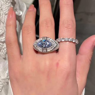 Pharaoh’s Eye Ring by Azzallure featuring a vivid royal blue lab sapphire in a bold sterling silver setting with intricate detailing.

