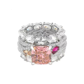 Bold sterling silver cocktail ring featuring a radiant pink lab sapphire center with pavé-set accents, designed for glamorous statement wear.