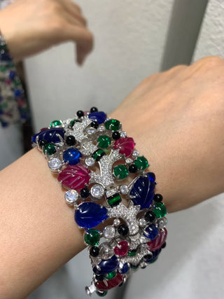 Twilight Flora silver cuff bracelet with floral design and lab sapphires – bold wrist cuff inspired by nature and twilight beauty.