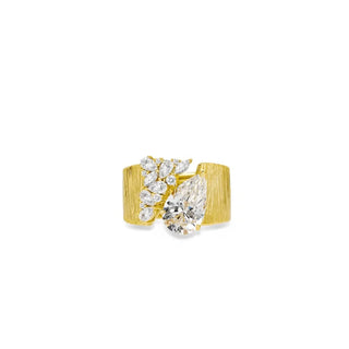Water Drop Cocktail Ring with bold pear-cut lab sapphire and scattered stones on a textured gold band