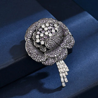Women’s purple flower brooch adorned with lab-created sapphires in a copper and silver setting, weighing 27 grams.