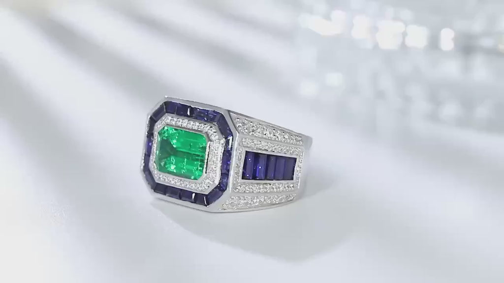 Azzallure Emerald Tempest Ring featuring a 3.18-carat emerald green lab sapphire, surrounded by blue and silver lab stones in a sterling silver diamond-style setting.
