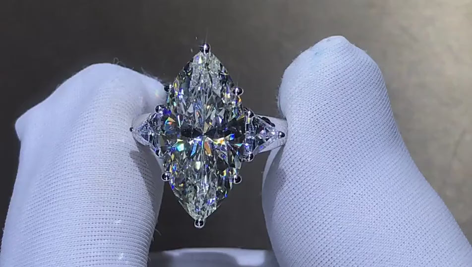 Maison Marquise engagement ring with 8-carat marquise Moissanite, diamond-style band in 925 silver, shown on hand

