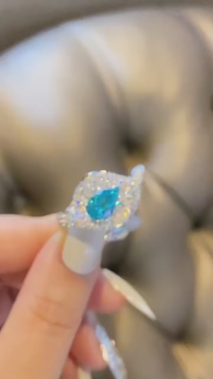 Blue Mirage aquamarine wedding and seal ring in 925 silver with lab sapphire side stones and prong setting
