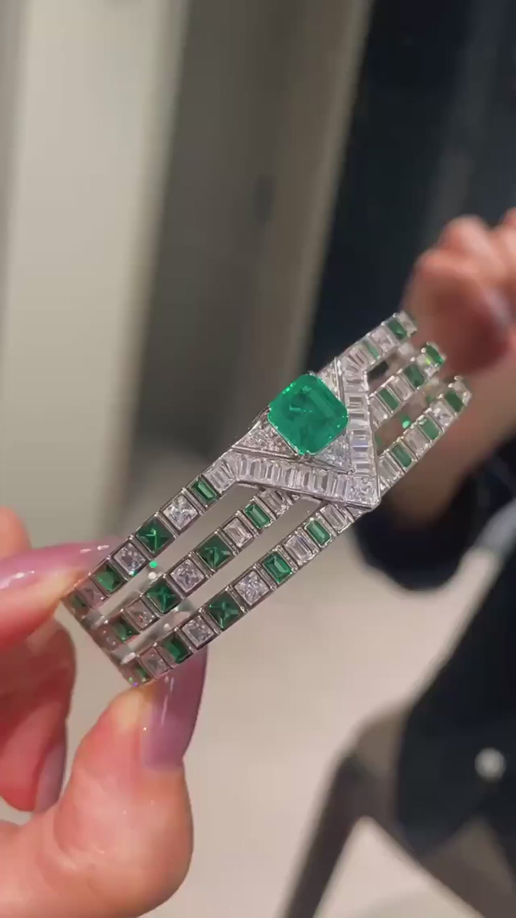 Emerald Vine Bracelet in sterling silver, featuring a vivid lab-created emerald sapphire surrounded by delicate side stones, evoking natural elegance.