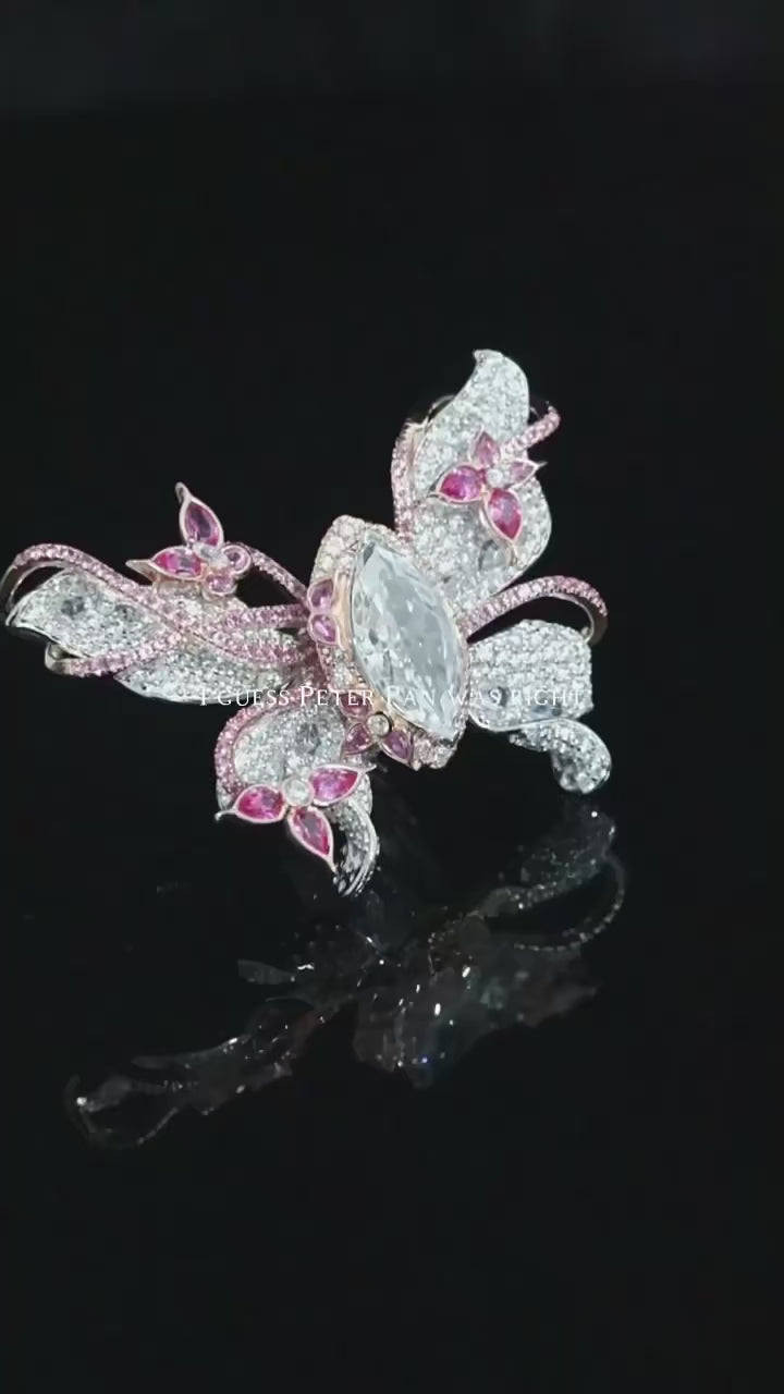 Papillon Pink Ring featuring a delicate butterfly-inspired design with shimmering pink gemstones, showcasing fine craftsmanship and elegant detail.
