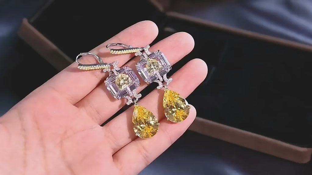 Sunveil Earrings in sterling silver with yellow lab sapphires, offering a delicate shimmer of sunlight-inspired elegance.