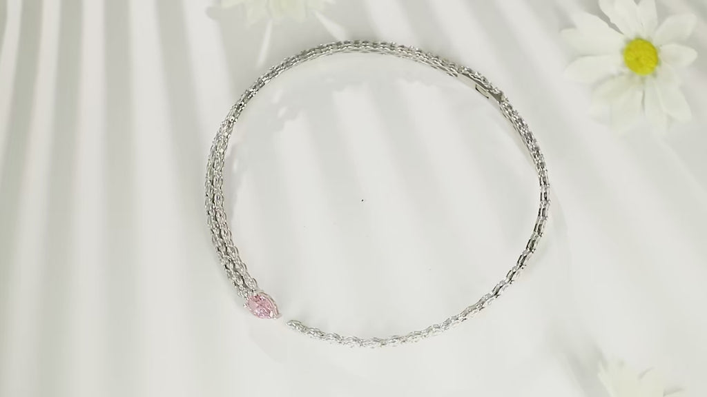 Iced Out Pear Bling Tennis Necklace in 925 sterling silver with pear-shaped lab-created sapphires in pink.