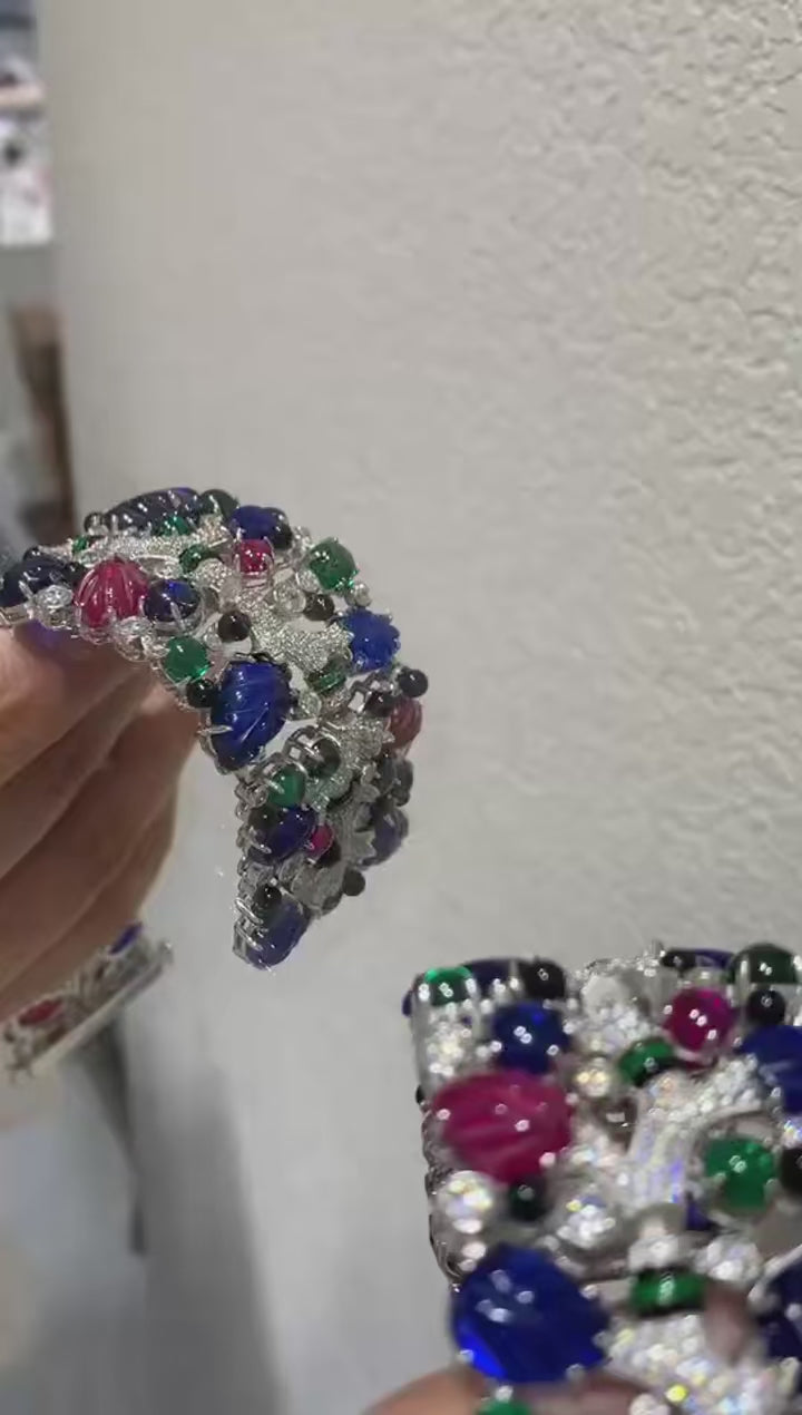 Twilight Flora silver cuff bracelet with floral design and lab sapphires – bold wrist cuff inspired by nature and twilight beauty.