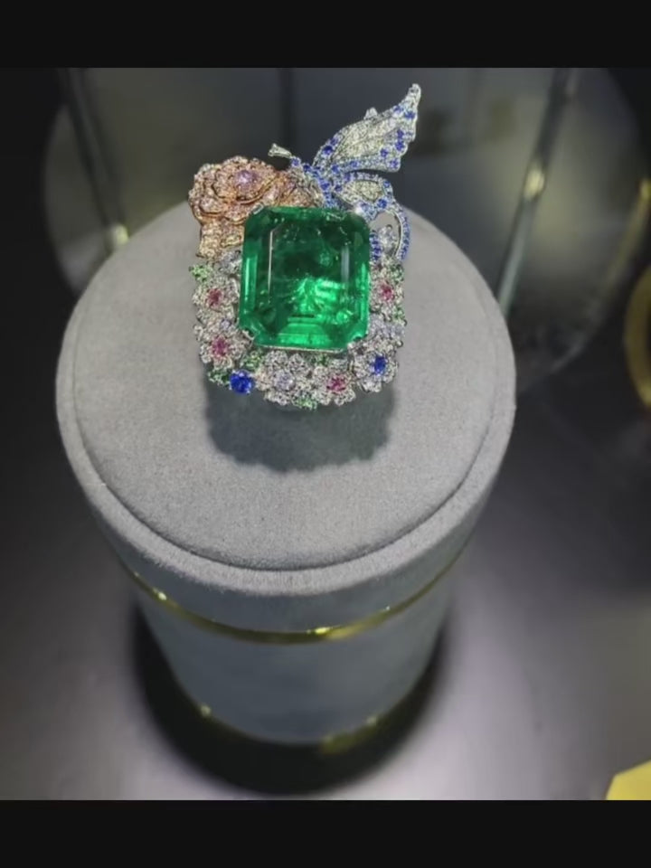 Wizard of Oz Butterfly Ring in sterling silver with a lab-created sapphire, surrounded by delicate butterfly wings adorned with shimmering side stones. A magical and enchanting piece.
