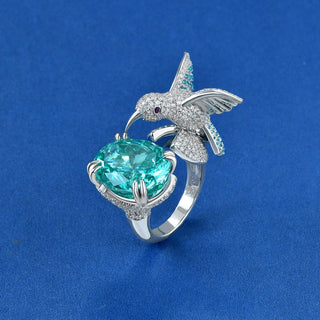 Paraiba Bird’s Nest Ring in sterling silver with crushed ice-cut Paraiba tourmaline, sculptural gemstone statement ring design.